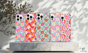 Tough vibrant floral pattern phone cases for iPhone and Samsung with durable shock-absorbing design and colorful glossy finish