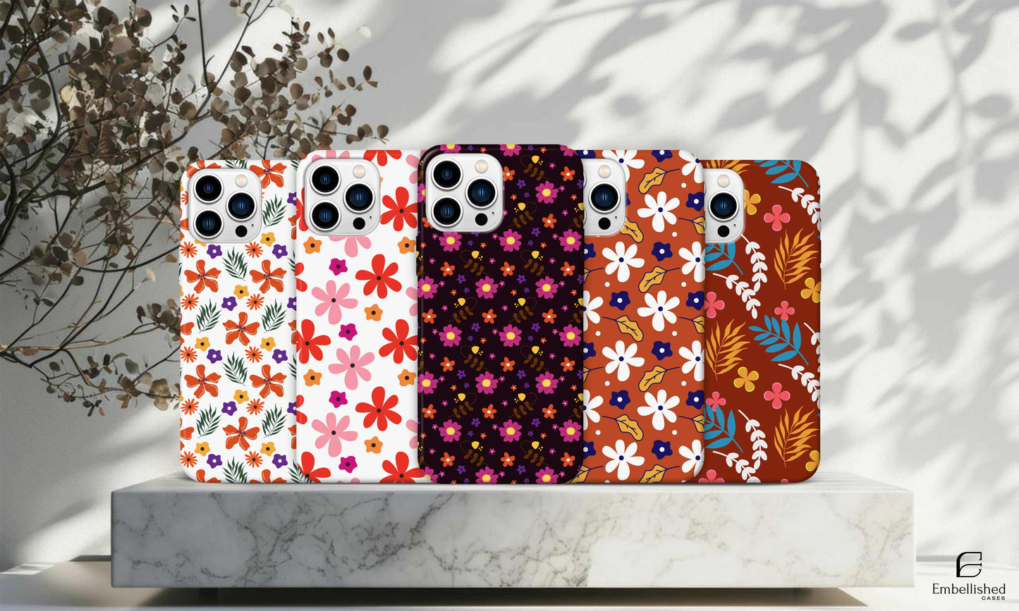 Stars Phone Case with colorful floral patterns for iPhone and Samsung models on marble platform