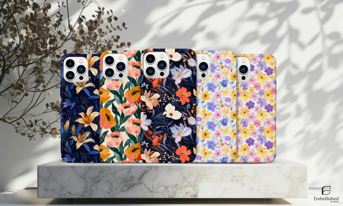 Tough phone cases with colorful floral designs for iPhone and Samsung models, durable impact-resistant protection with glossy finish and shock-absorbing liner.
