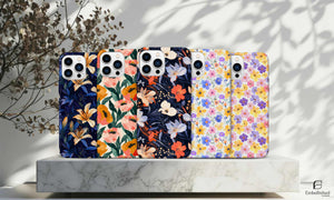 Tough phone cases with colorful floral designs for iPhone and Samsung models, durable impact-resistant protection with glossy finish and shock-absorbing liner.